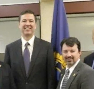 Dr. J. Richard Kiper with FBI Director James Comey.