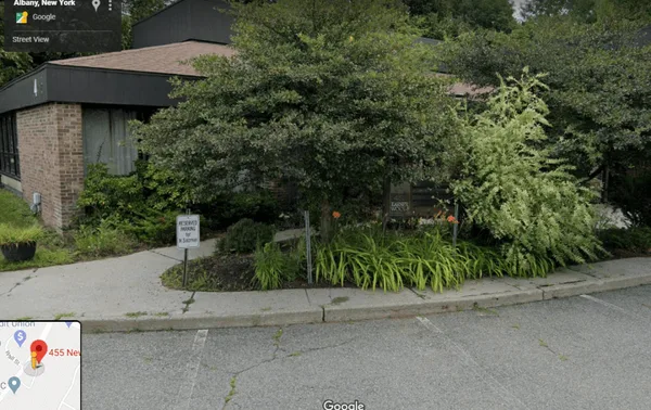 This Google Maps picture was taken during August 2019 - shortly after the conviction of Keith Alan Raniere - and shows the replacement Nancy Salzman sign in place. The sign next to it – which used to be reserved for current Nxivm leader Edgar Boone is now down.