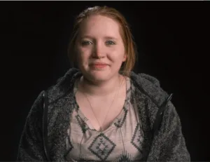 Carysa Long, seemingly without tics, is suing for psychological damage.