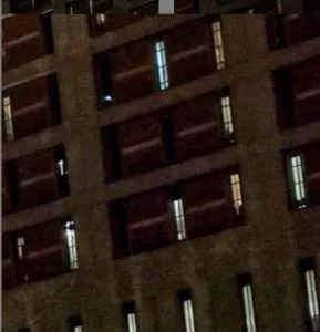 The prisoners look out from their cell windows to see the dancers.