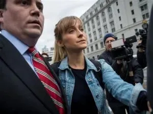 Sean Buckley with Allison Mack after she was released on $5 million bail and subject to home arrest.