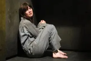 The media loves to publish this photo of Nicki Clyne to show how she is a captured and brainwashed slave.  Actually it is a photograph of her from an episode of Battlestar Galactica, where she was captured and made a slave.