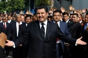 This picture taken on August 9, 2017 shows the leader of the Church of the Light of the World, Naason Joaquin Garcia, walking among his parishioners in Guadalajara, Mexico. - The leader of La Luz Del Mundo, an international religious organization based in Mexico, has been arrested in California on charges of human trafficking, child rape and other felonies, authorities said on June 4, 2019. Naason Joaquin Garcia, who heads the organization that claims one million followers worldwide, and three co-defendants allegedly committed 26 felonies in southern California between 2015 and 2018. (Photo by ULISES RUIZ / AFP)        (Photo credit should read ULISES RUIZ/AFP/Getty Images)