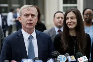 US Attorney Richard Donoghue with Assistant US Attorney Moira Penza at press conference following Keith Alan Raniere's conviction.