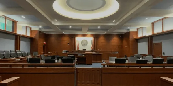 The procecution table is within feet of the jury.