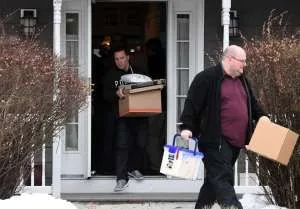 Photo courtesy Albany Times Union: FBI agents leave with boxes of records - and shoe boxes and envelopes with half a million in cash at Nancy Salzman's house. Salzman is known to her followers as "Prefect" but may soon have her own Federal Prisoner Number just like Raniere.