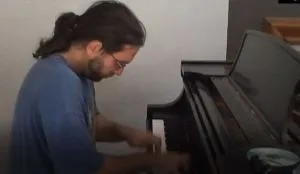 Keith Raniere played the piano.