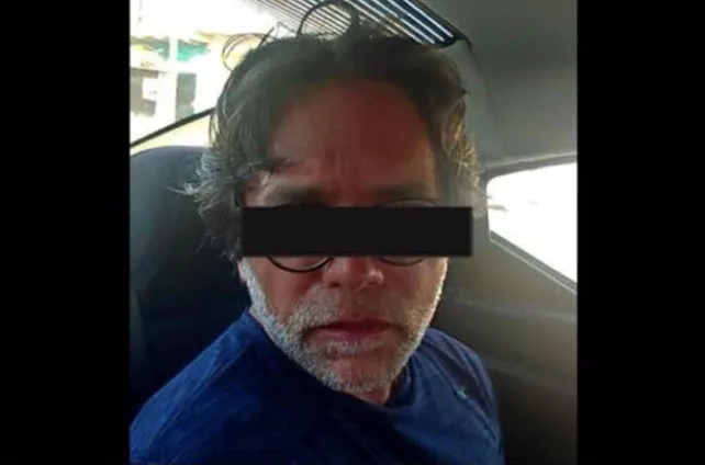 Rare picture of Raniere in police car.