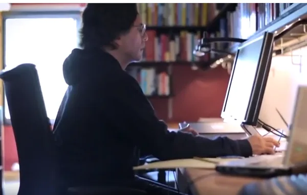 Keith Raniere at his desk at the library