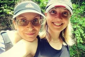 Clare Bronfman with her employee Nicki Clyne.  The government has searched the sinister one's email account.
