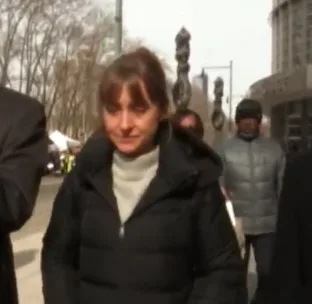 Allison Mack appeared to hold back tears when leaving court