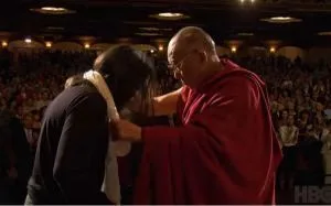 The Dalai Lama puts a white scarf on Keith Alan Raniere after the Dalai Lama's lecture on Compassionate Ethics in Difficult Times on on May 6, 2009, in Albany New York.