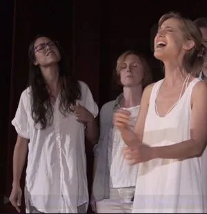 Women sing to the Vanguard at Vanguard Week
