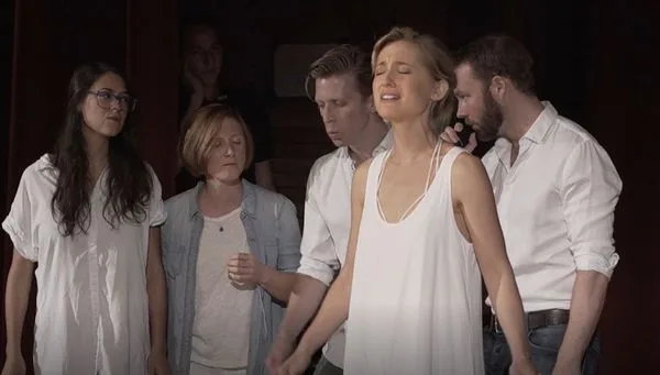 Allison Mack performs with the a capella singing group Simply Human.