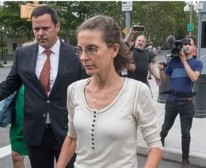 John Sandweg walks with his client Clare Bronfman