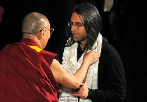 Two spiritual masters: The Dalai Lama and Master Raniere. Although they teach different philosophies, Master Raniere's slaves say that his teachings are as high or higher than the Dalai Lama's.