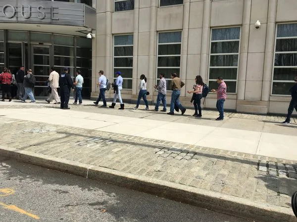 A pool of some 500 potential jurors were narrowed down to 12 jurors and six alternates  in the trial of Keith Alan Raniere. The following post is by one of the 500 who was rejected as a juror and is therefore free to speak about her experience. The photo is a line of potential jurors arriving in April for jury selection in the Raniere case. [Photo Dianne Lipson]
