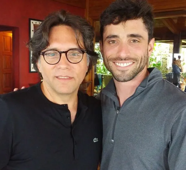 When Ethan Klein showed this photo of Keith Raniere and Marc Elliot during his interview, Klein said, in deadpan, Raniere has 'nice skin."