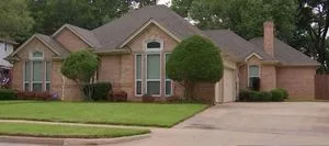 The government seeks a forfeiture of this home at 6812 Kennedy Drive, Colleyville, Texas owned by William Roy Stone.