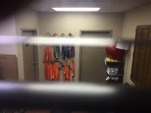 Colored sashes on the wall.