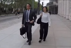 Lauren Salzman leaves court with her Arizona attorney, Hector Diaz.
