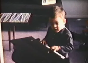 Young Raniere on the keyboard.