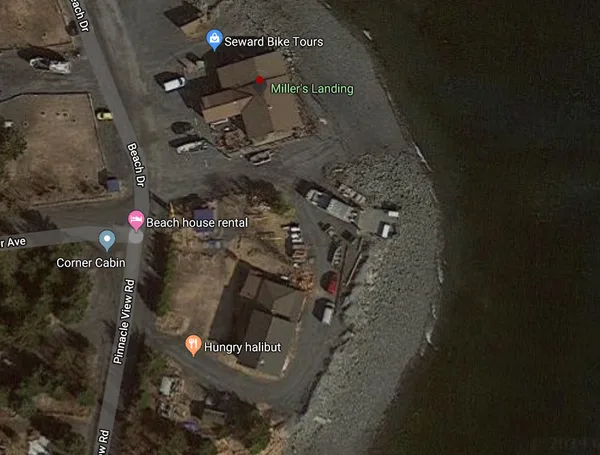 Where the Google aerial map reads "Beach" is just north on the road from where Kristin Snyder's pickup truck was left. The word "House" signifies an area about where the shed is. The kayak, if not taken from the shed but taken from the yard, would have been just south of the shed. The Millers' home is where the word "Halibut" is. In addition to Miller's Landing, the Millers own and operate a food stand where they cook fresh halibut and other fish from the waters.