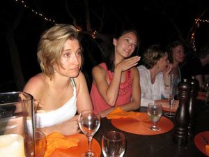 At a secret week long gathering in Necker Island, NXIVM women imbibe liquor and learn the secrets of their master, Keith Raniere. If the two women closest to the camera look familiar it is because you may have seen them on TV; They are acresses Kristin Kreuk and Allison Mack, long-time devotees and purported harem members.