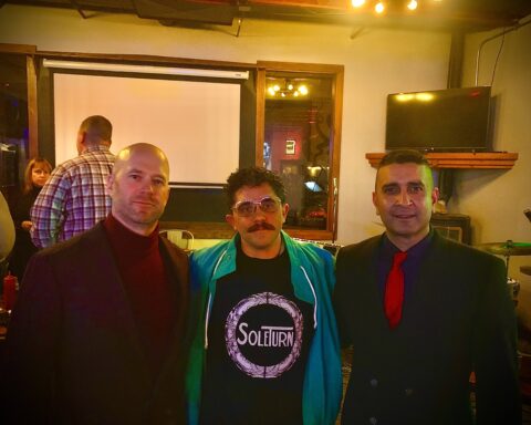 three men posing for a picture