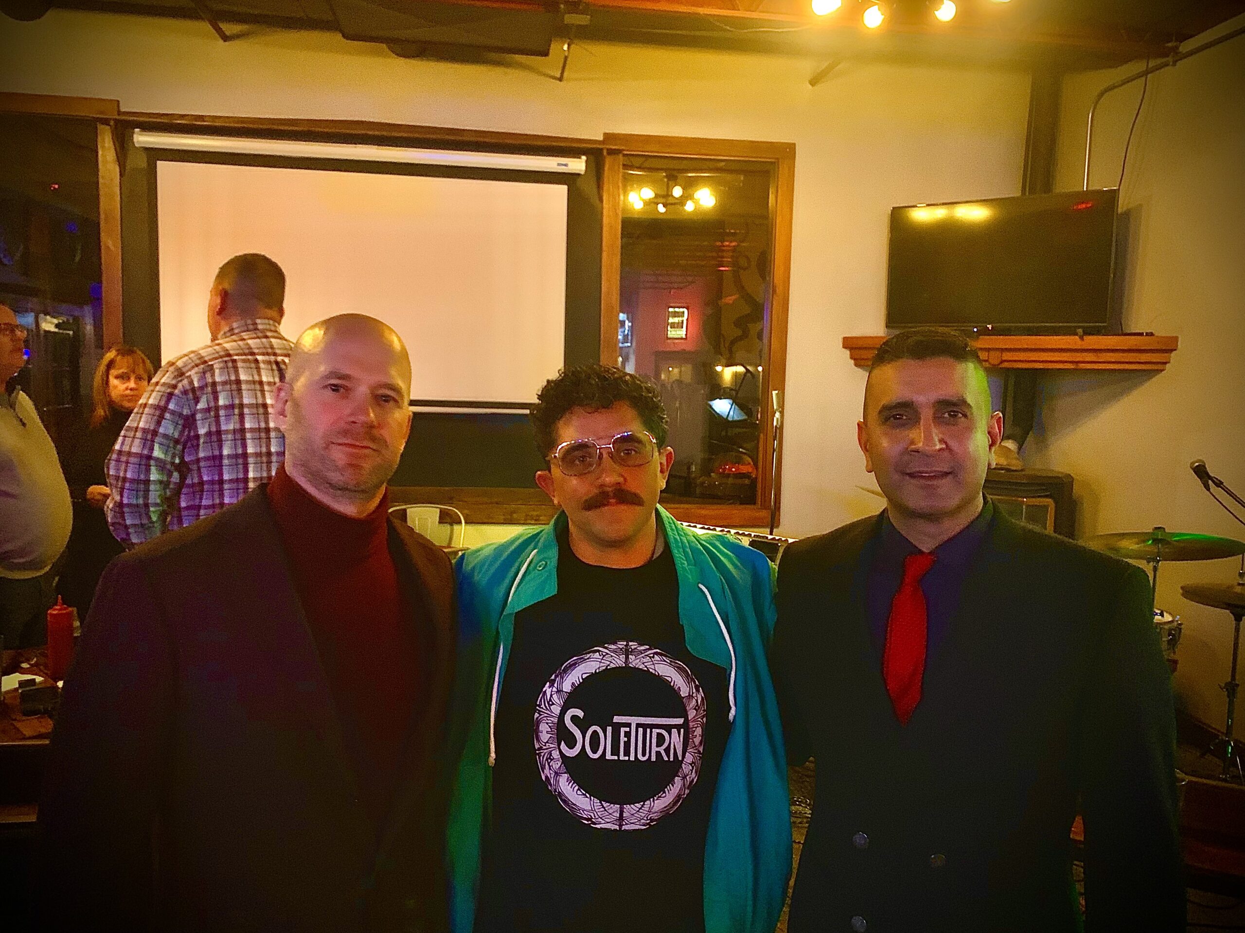 three men posing for a picture