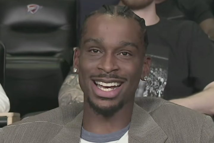 Shai NBA MVP Is Shai Gilgeous-Alexander For The Second Year In A Row And He Got 83 Of 100 Votes Shai Gilgeous-Alexander was named the 2025-26 Kia NBA Most Valuable Player on Sunday May 17, 2026, winning back-to-back MVP awards in one of the most dominant voting performances the award has produced in years. The Oklahoma City Thunder guard received 83 of 100 first-place votes from the global media panel, a margin so decisive that the debate about who deserved the award was largely academic for most of the season. Nikola Jokic finished second with 10 first-place votes. Victor Wembanyama finished third with five. The announcement was made at 7:30 PM Eastern on Amazon Prime just before the start of Game 7 of the Cleveland Cavaliers-Detroit Pistons series. ESPN's Shams Charania had reported the outcome earlier Sunday morning, beating the league's announcement by several hours in the same pattern that has become a feature of major NBA award reveals. Gilgeous-Alexander is the first guard since Stephen Curry won the award in 2015 and 2016 to win consecutive MVP trophies. He is the 16th multiple-time MVP in league history. His Thunder finished the regular season 64-18, securing the top overall seed in the Western Conference for the second consecutive year. He now has two days to enjoy it. The Thunder open their Western Conference Semifinals series Monday against the San Antonio Spurs and Victor Wembanyama, the player who finished third in MVP voting and who represents the most credible challenge to SGA's dominance heading into next season. The Season That Won It Gilgeous-Alexander's raw scoring numbers actually declined from last year's MVP campaign, he averaged 31.1 points per game in 2025-26, down from 32.7 the previous season. By virtually every other measure, the case for giving him the award was stronger than it was in 2025. The efficiency leap is the number that defines the season. Gilgeous-Alexander closed the year shooting 55.3 percent from the floor, 38.6 percent from three and 87.9 percent from the free throw line. He averaged 6.6 assists and 4.3 rebounds across 68 games. CBS Sports noted that the only other player in NBA history to achieve those shooting percentages on more than 250 total shots was Kevin Durant, who did it in 47 games during the 2022-23 season. Gilgeous-Alexander sustained it across a full season. The broader argument for his back-to-back was not purely individual production. The Thunder finished 64-18 despite dealing with injury absences throughout the year, not just Gilgeous-Alexander's own injury in February, but contributions from a roster that was tested at various points. Oklahoma City held off the San Antonio Spurs down the stretch for the top seed in a Western Conference that was more competitive than it had been in years. Every win during the periods when the roster was limited was a game in which Gilgeous-Alexander was the reason the Thunder were competitive at all. The Voting And What It Means The 83 first-place votes Gilgeous-Alexander received from 100 total media voters represent a near-landslide by the standards of a league where three-way MVP races have been common in recent seasons. Jokic, who received 29 first-place votes in the 2024-25 vote and 71 second-place votes, dropped to 10 first-place votes this year with 48 second-place. Wembanyama received five first-place votes, reflecting genuine support from a minority of voters who felt his combination of offensive improvement and unanimous Defensive Player of the Year impact made him the most valuable player in the league. The full voting breakdown shows a race that was decided long before Sunday's announcement. Luka Doncic, who posted a 600-point scoring month in March, the first player to do that in March since Michael Jordan in 1987, still finished fourth with zero first-place votes and 250 total points. Cade Cunningham of the Detroit Pistons received two first-place votes and 117 total points in fifth. Jaylen Brown, Kawhi Leonard and Donovan Mitchell also received voting points. The 83 first-place votes put Gilgeous-Alexander short of a unanimous award but well ahead of everything short of an actual coronation. In the modern era of MVP voting, where three-way debates have sometimes produced winners with fewer than 50 first-place votes, his margin is a statement about the clarity with which the voter community viewed the race. The Jokic and Wembanyama Context The second and third place finishers are both consequential stories in their own right. Nikola Jokic's second-place finish is his sixth consecutive top-two finish in MVP voting, a mark that matches Bill Russell and Larry Bird for the most consecutive top-two finishes in NBA history. Jokic averaged 12.9 rebounds and 10.7 assists per game this season, leading the league in both categories, while continuing to operate as one of the most creative offensive players the sport has ever produced. The argument against him was not that he was not excellent. It was that Gilgeous-Alexander was more excellent by the specific measure of individual impact on wins. Wembanyama's third-place finish represents something more complex. The 22-year-old Spurs center became the youngest player and first unanimous winner of the Defensive Player of the Year award in 2025-26, and the Spurs returned to the playoffs for the first time since 2019 largely on the strength of what Wembanyama has become. His late-season offensive surge, averaging over 29 points per game across the final month, generated the first serious MVP momentum he had accumulated in his young career. The specific question that the MVP debate around Wembanyama raised was whether a player who anchors both ends of the floor as completely as he does should be given more weight in MVP consideration than the voting ultimately reflected. Five first-place votes suggest that a meaningful minority of informed observers believed he should win. The Spurs-Thunder first-round series beginning Monday will be the first direct extended competition between the top two MVP vote-getters of the future, a matchup that will generate its own data points about which player's presence matters more in a playoff environment. The Back-To-Back In Historical Context Winning consecutive MVP awards places Gilgeous-Alexander in company that requires listing to appreciate. The other players who have won back-to-back NBA MVPs: Bill Russell, Wilt Chamberlain, Kareem Abdul-Jabbar, Moses Malone, Larry Bird, Magic Johnson, Michael Jordan, Charles Barkley, David Robinson, Karl Malone, Shaquille O'Neal, Tim Duncan, Steve Nash, LeBron James and Stephen Curry. The list reads as a catalogue of the greatest players the sport has produced. Curry is the most relevant direct comparison. He won consecutive MVPs in 2015 and 2016, the second of which was unanimous, while leading Golden State teams that remain the template for modern NBA championship construction. Gilgeous-Alexander is following a similar trajectory, dominant individual production in service of a team that has genuinely transformed the Western Conference's competitive balance. The championship conversation is the next chapter. Jordan and LeBron are among the historical MVP winners who won championships in their back-to-back MVP seasons. If Gilgeous-Alexander leads the Thunder to the title this June, he joins a specific group, players who won consecutive MVPs and a championship in the same year as the second one. The Spurs are in his way starting Monday. Wembanyama is waiting. What's Next For Gilgeous-Alexander? Gilgeous-Alexander was asked about the upcoming series at his MVP press conference and offered the diplomatic generosity that the moment required before the competition began. "Obviously, a really good team," he said of the Spurs. "They've been right behind us all year, so we obviously don't take them in the slightest. They're a really good team." The Thunder are the No. 1 seed. The Spurs finished their own regular season as one of the most dramatic late-season stories in the Western Conference, Wembanyama carrying San Antonio back to relevance in a market that had gone quiet after the Tim Duncan era. The series is the matchup that the basketball world has been anticipating since mid-season when it became clear that these two teams would likely meet in the playoffs. SGA has the MVP trophy. Wembanyama has the Defensive Player of the Year award. Both are starting the second round of the playoffs Monday night in Oklahoma City. Shai Gilgeous-Alexander